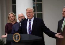 Talks Back On? War Games Dialed Down man speaking at podium with officials standing behind