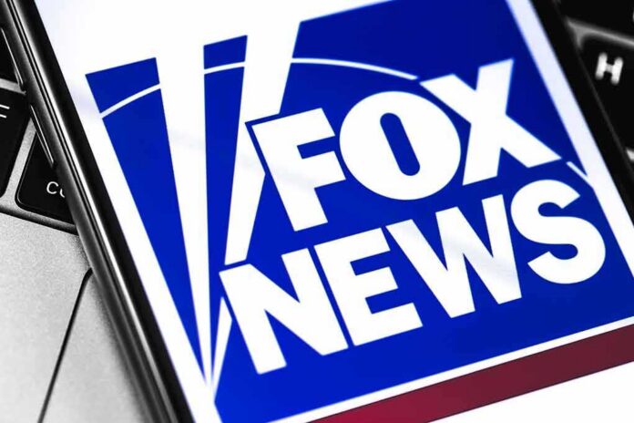 shutterstock_1350152534 Fox News logo displayed on a smartphone screen