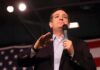 Texas Race Becomes a Cash Inferno man speaking into a microphone at a rally