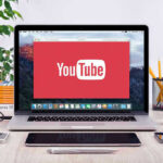 Political Rules Snag Elon Documentary YouTube logo on a laptop screen on desk.
