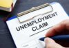 Jaw-Dropping Math: $181k Per Poor Family Unemployment claim form on clipboard with hand holding pen