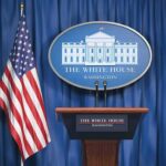 Hormuz Hostage Play – Trump Says No White House press briefing podium and US flag