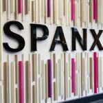 Celebrity ‘Empires’ Exposed: The Hidden Illusion Spanx logo on a colorful wall installation