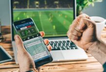 Betting Edge Exposed—AI’s World Cup Test Person checking live soccer betting odds on a smartphone