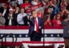 Iran Warning: Annihilate… Or Talk? Donald Trump points from a rally stage; Rudi Koertzen and Bear Pascoe are in the crowd