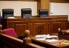 Late-Term Abortion Triggers Estate Payday empty courtroom with judge's bench and microphones
