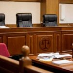 Late-Term Abortion Triggers Estate Payday empty courtroom with judge's bench and microphones