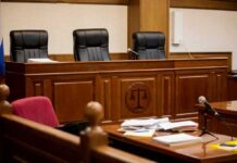 Late-Term Abortion Triggers Estate Payday empty courtroom with judge's bench and microphones