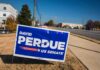 Campaign yard sign by a roadside