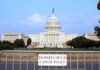 Impeachment Ambush Over Iran Strikes View of the U.S. Capitol building with a security barrier in front