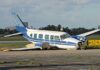 Runway Inferno After Boozy Cockpit? Damaged blue and white small airplane on an airport runway