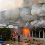 Safety Lapses, Bodies Pile Up firefighters respond to large building fire with heavy smoke