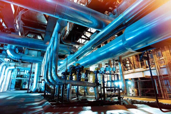 shutterstock_567556192 Industrial plant with large metal pipes and gauges