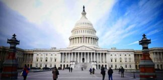 United States Capitol building with visitors on the plaza