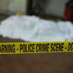 Shocking Grooming Claims Rock Top Detective crime scene tape in foreground with covered body in background