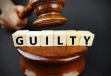 Ohio’s Two-Lane Justice Shocks Court Judge's gavel above blocks spelling guilty