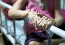 Epilepsy Gel Stuns: Knees Rebound Elderly person’s hands resting on a hospital bed rail