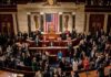 Leonard Lance and Claude Guéant among lawmakers on a legislative chamber floor