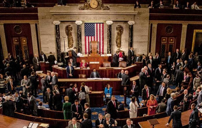 shutterstock_1186368265 Leonard Lance and Claude Guéant among lawmakers on a legislative chamber floor