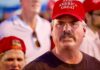 639,000 Republicans Flagged, Who’s Exposed? Man in red cap at a crowded event