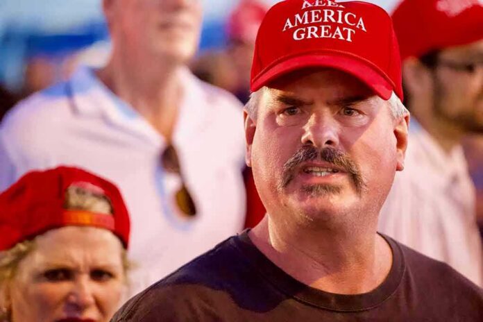 Man in red cap at a crowded event