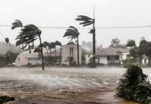 Category 2 Threat Rockets Toward Coast Houses battered by hurricane winds and flooding