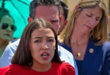 AOC Torches Loan Rule – War On Women? Celines Toribio speaking at an outdoor event with people standing behind her