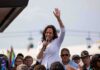 Kamala Harris Rally Sparks Mississippi Uproar Kamala Harris speaking at outdoor rally, Paul Scholes in the crowd