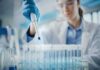 No Plague? Then Why Lockdown 200 Scientist using pipette to fill test tubes in a laboratory
