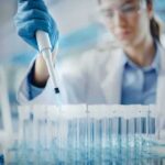 No Plague? Then Why Lockdown 200 Scientist using pipette to fill test tubes in a laboratory