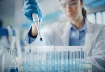 No Plague? Then Why Lockdown 200 Scientist using pipette to fill test tubes in a laboratory