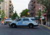 Mayor Demands ICE Gone After Bronx Bullets NYPD police SUV blocking a city street at a taped-off scene