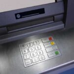 Bank Blunder: $128K Left on ATM Close-up of an ATM keypad with numeric buttons and function keys
