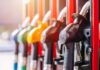Close-up of fuel pump nozzles at a gas station
