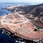 Coastal tent camp on a rocky peninsula