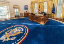 Rare Move? Bishops Huddle With Trump Oval office with wooden desk and blue presidential seal rug