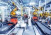 Bill Gates’ Robot Tax Bombshell Industrial robots assembling parts on an automated factory line