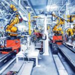 Bill Gates’ Robot Tax Bombshell Industrial robots assembling parts on an automated factory line