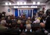 Trump Pushes Out New Press Chief? Press secretary at podium addressing reporters in briefing room
