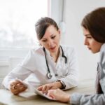Mushrooms Jolt Alzheimer’s Doctor consulting a patient at a desk